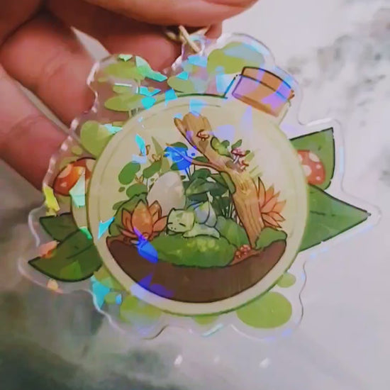 A short video showing the broken glass holographic effect in the keychain's arcrylic resin.